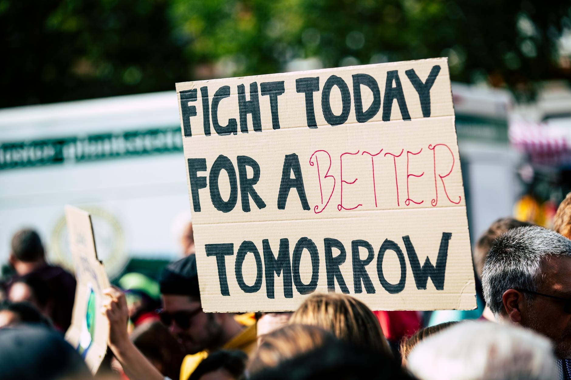 Protest with a sign that says Fight Today for a Better Tomorrow